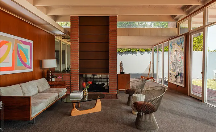 Dual fireplace in the living room of Case Study House 18 designed architect Rodney Walker