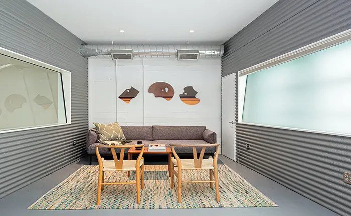 This creative Echo Park modern home boasts a custom Sound-Office-Art-Podcast capable studio downstairs.