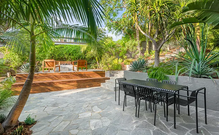 the highlight of this creative Echo Park modern home is the multi-tiered backyard with lush landscaping