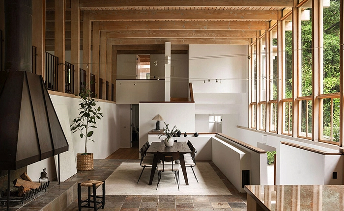 This Vernon Duckett mid century home showcases magnificent 27-foot wood beam ceilings.
