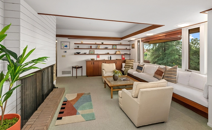 James De Long Mid Century home with a floor to ceiling brick fireplace