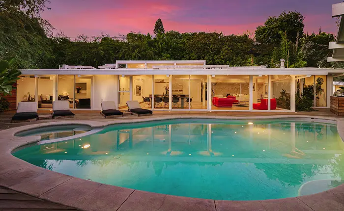 A freeform style pool at a mid century home designed by architect Richard Dorman