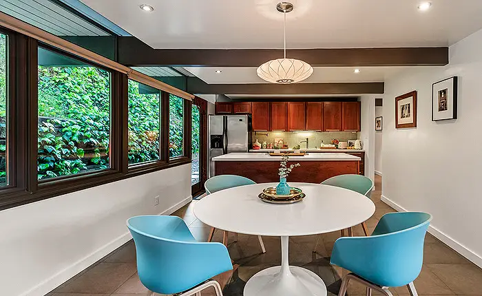 Kitchen and dining room of a mid-century modern home designed by architects Buff and Hensman in Los Angeles