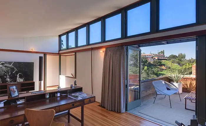 Harwell Hamilton Harris hillside home with clerestory windows and a private outdoor deck