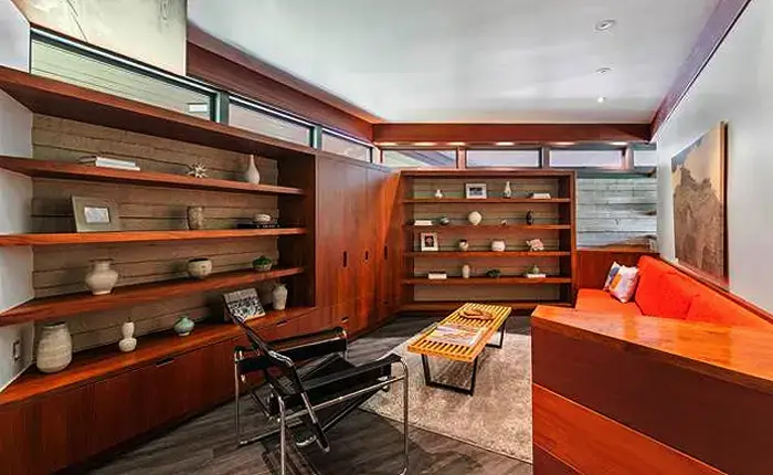 Interior of a Lloyd Wright Usonian style house in La Canada Flintridge showcasing clerestory windows and built-in furniture