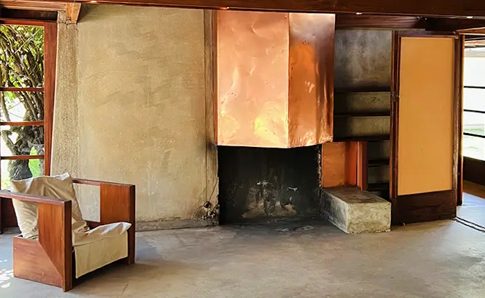 Schindler Kings Road House interior living space and copper fireplace West Hollywood